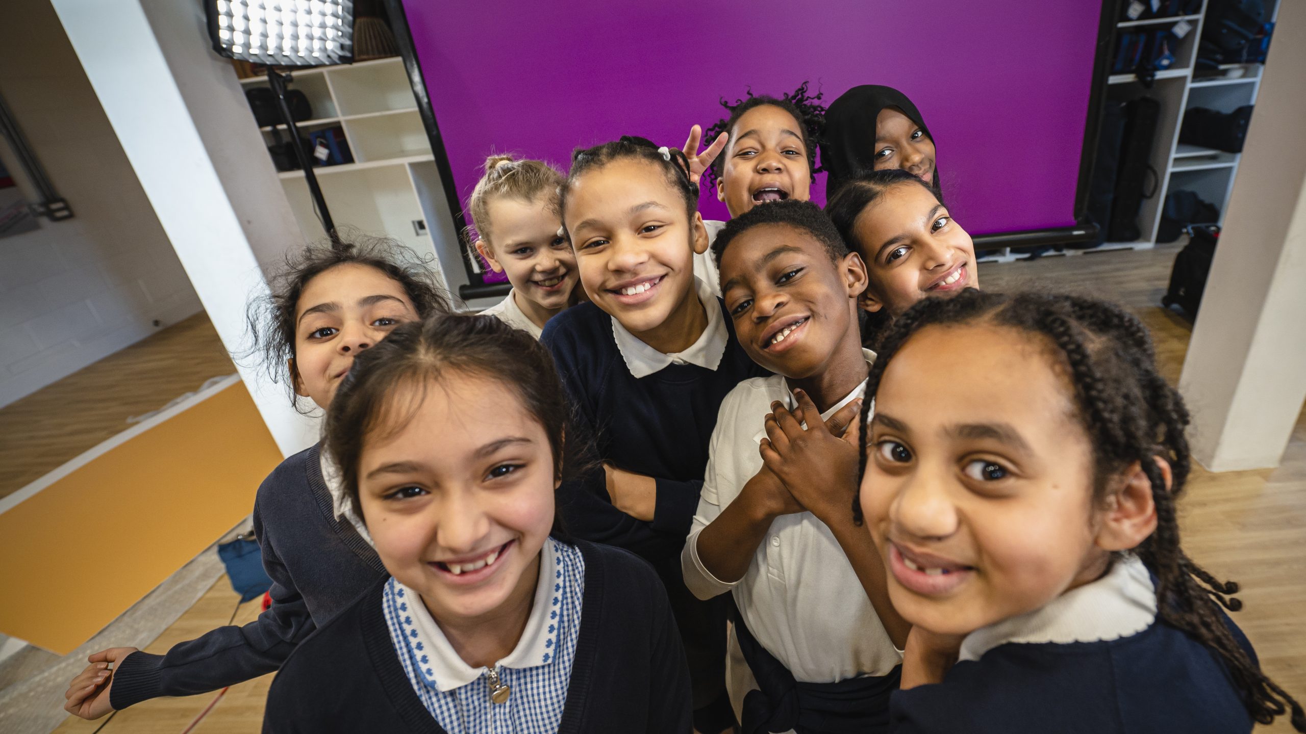 A group of primary school children smiling