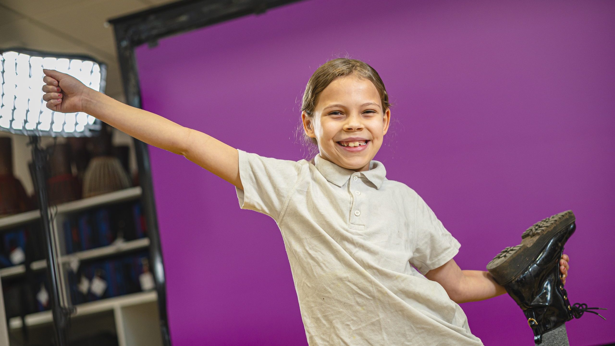 young blonde girl striking a gymnastics pose