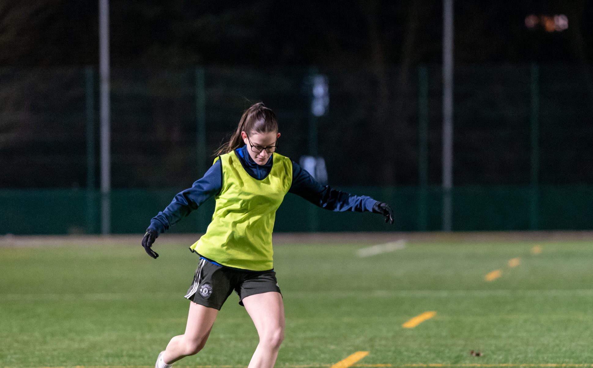 Two young women playing football