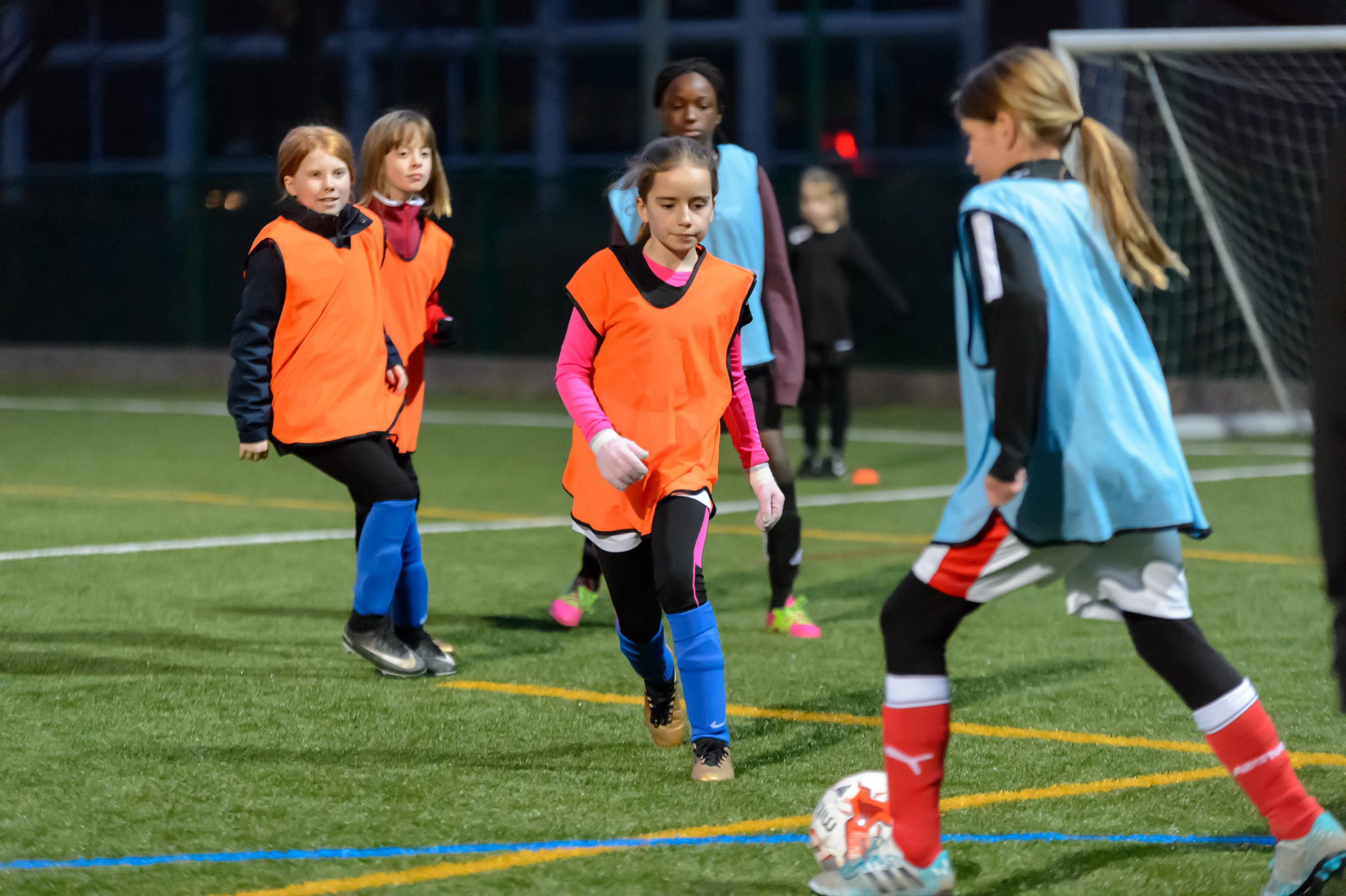 Primary school girls playing football