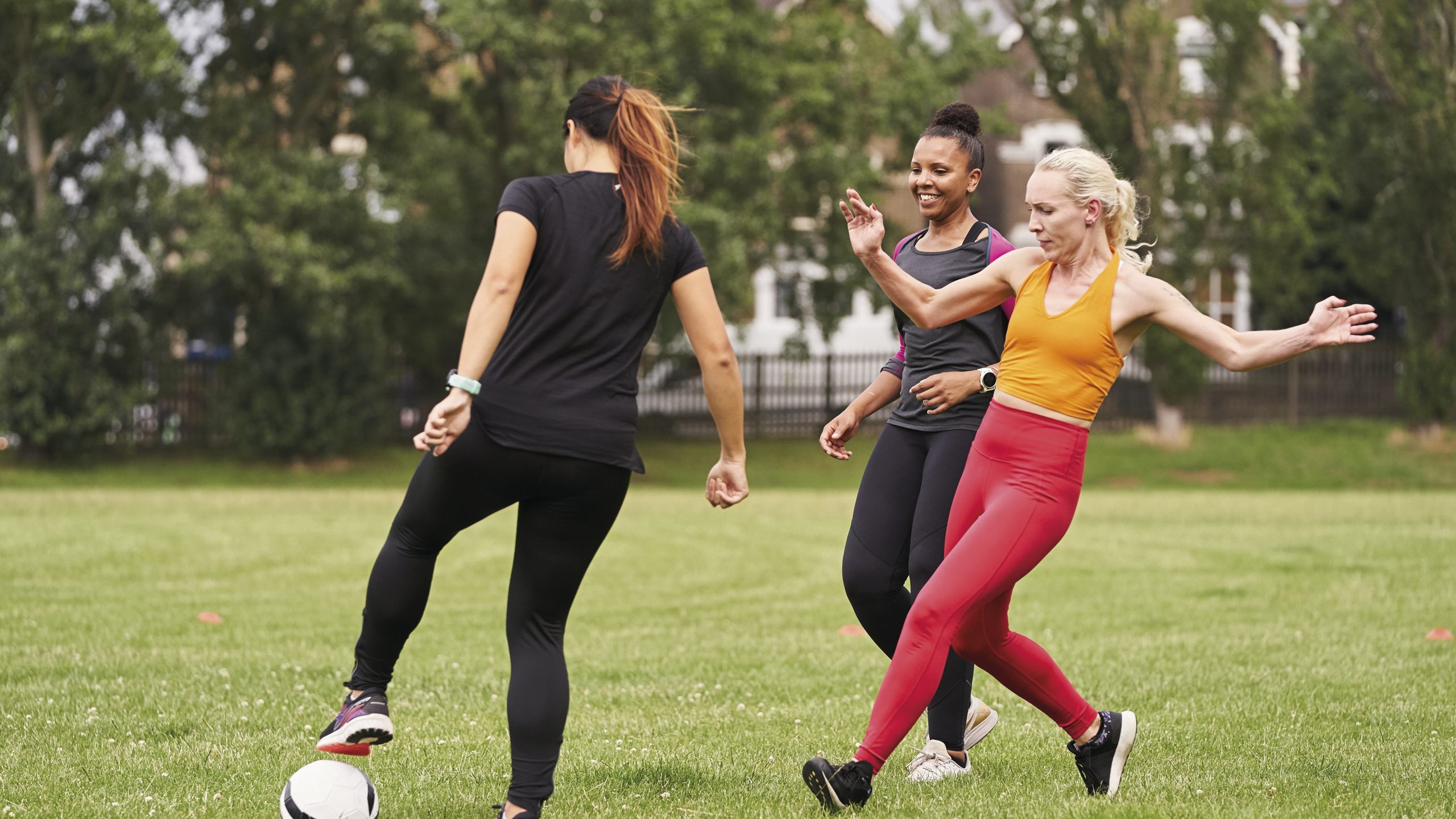 A group of women aged 34-55 playing football