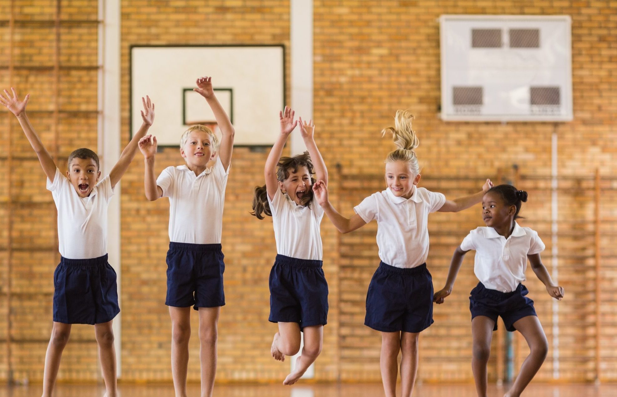 Young children in school PE hall