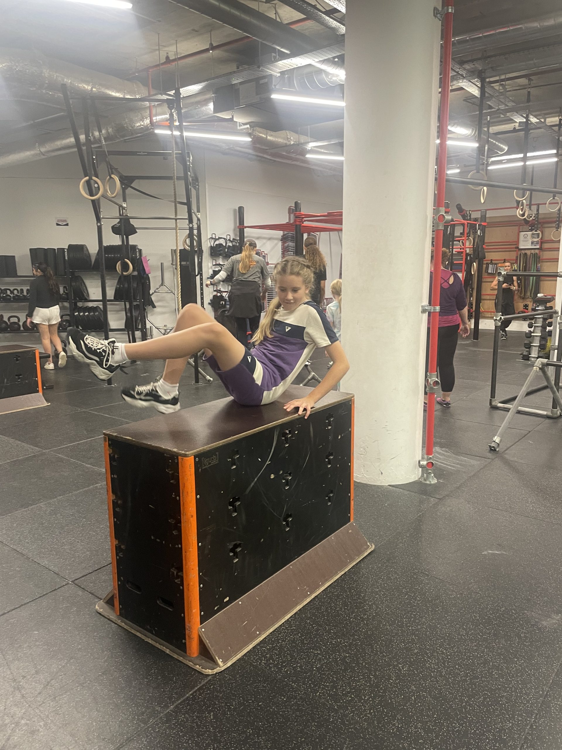 A young teenage girl trying Parkour at our workshop