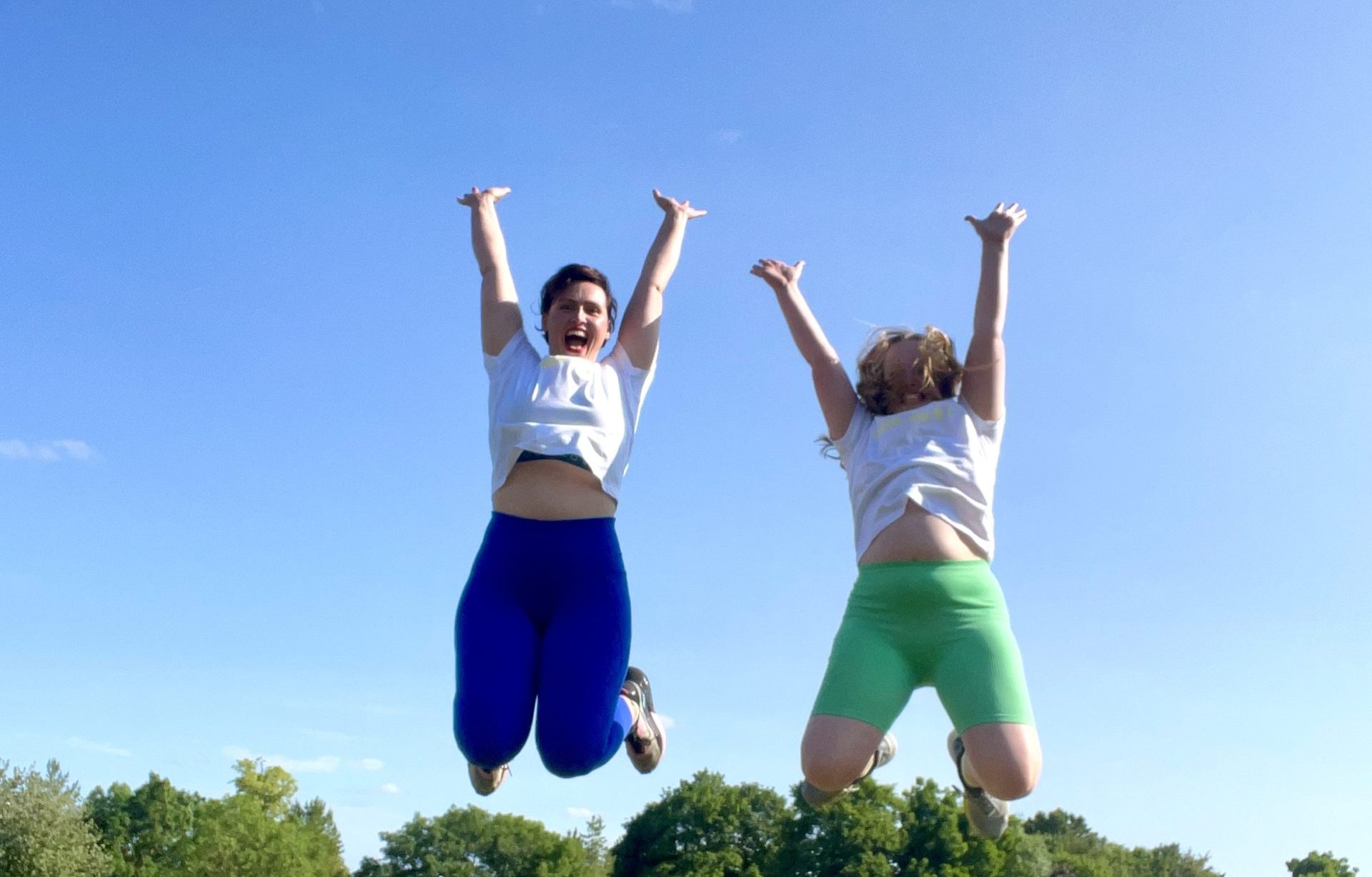 Mum Mel and her Daughter Lily jumping in the air