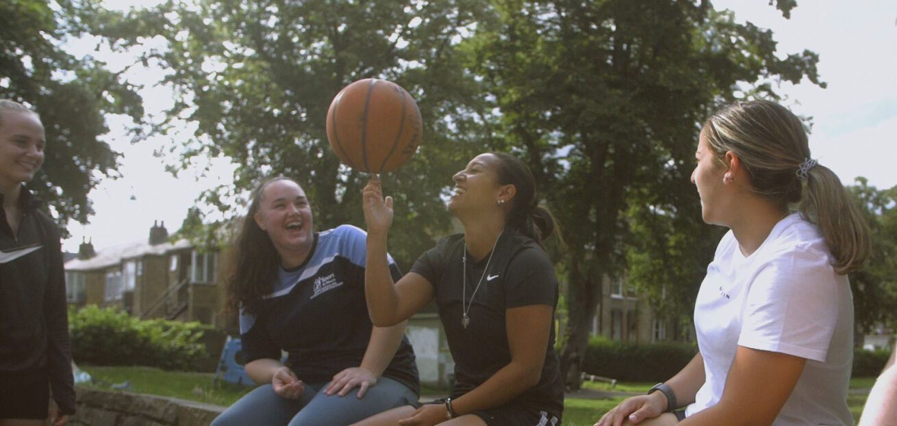 Jade playing basketball with friends