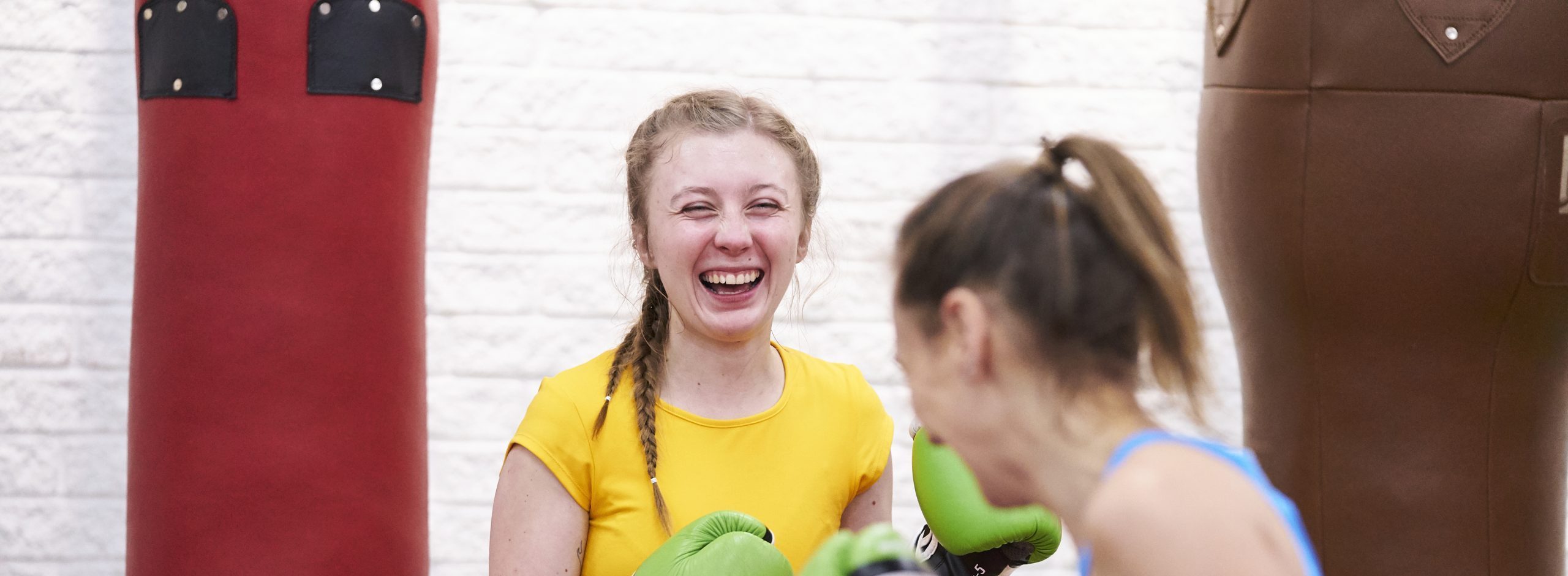 Two white women boxing