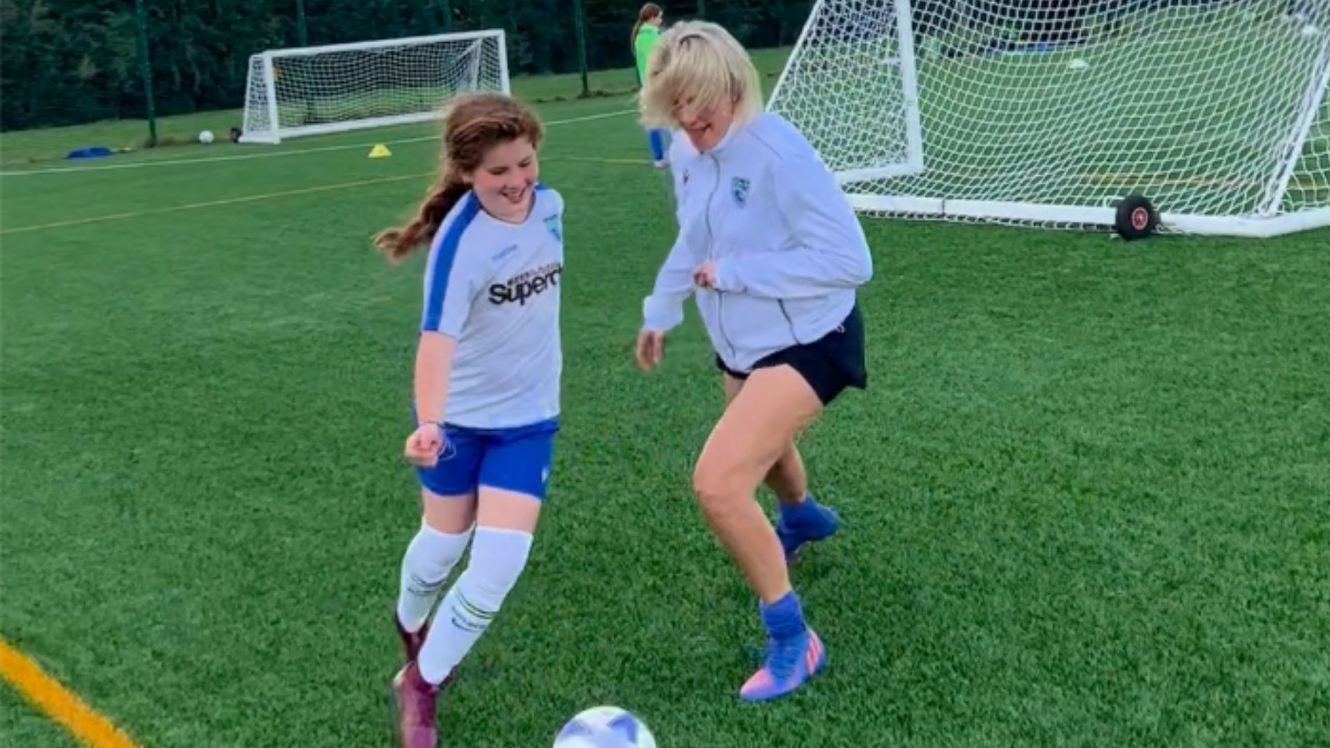 Lauren and Freya playing football together