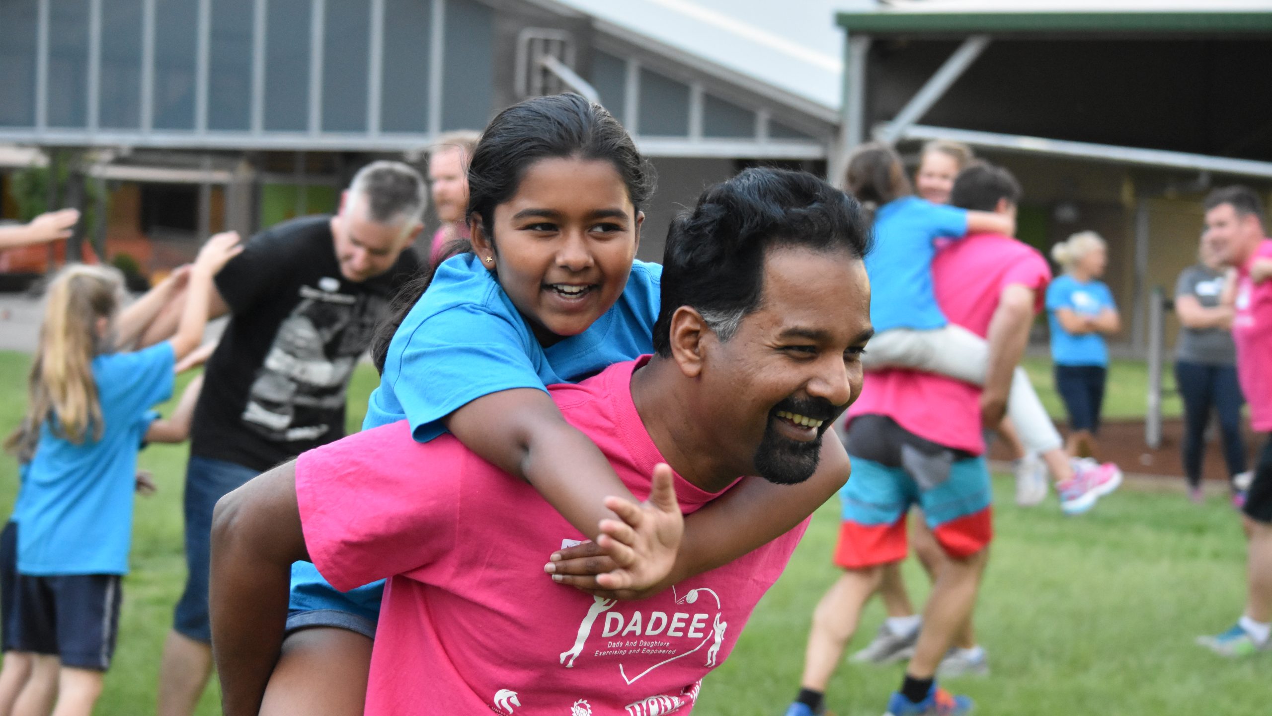 A south asian daughter and dad having a piggy back