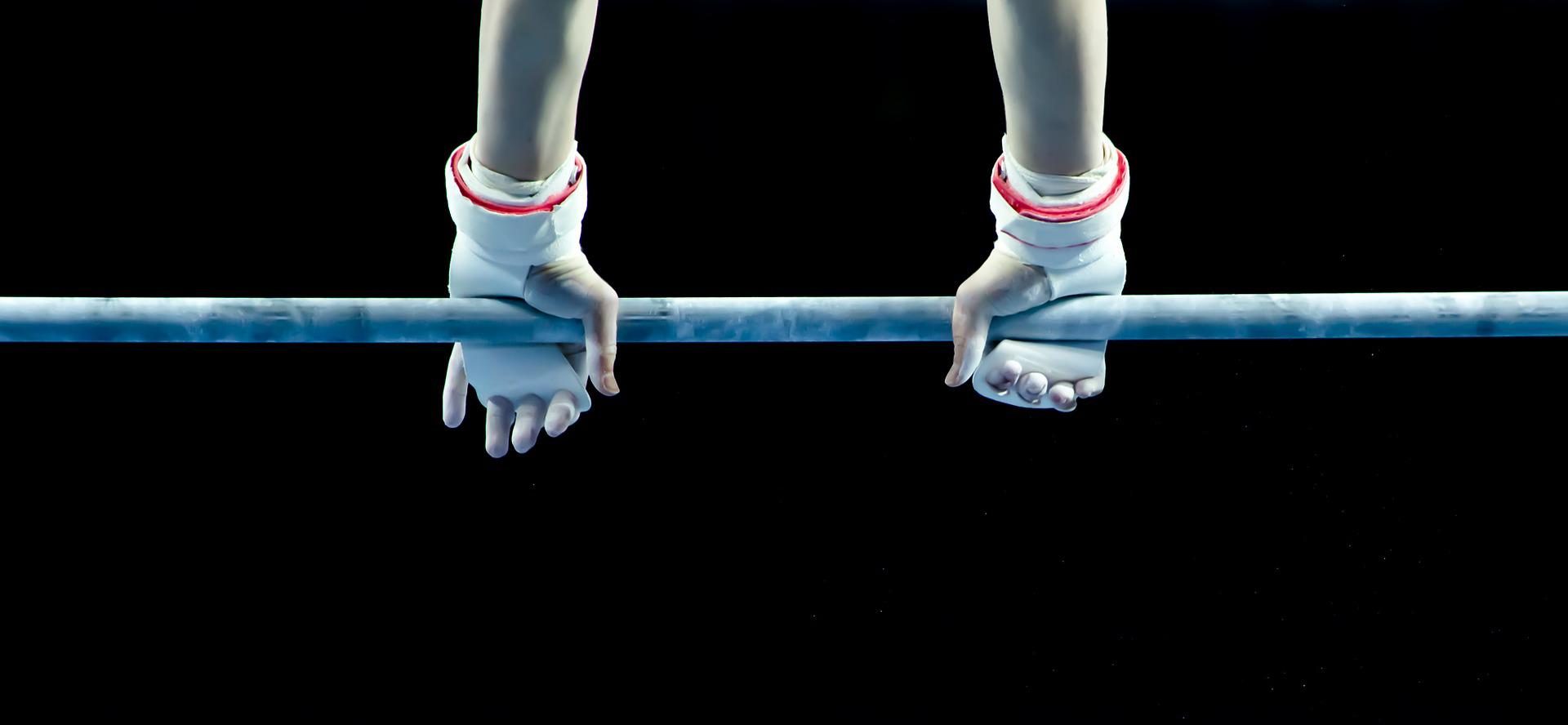 Hands on a gymnastics bar