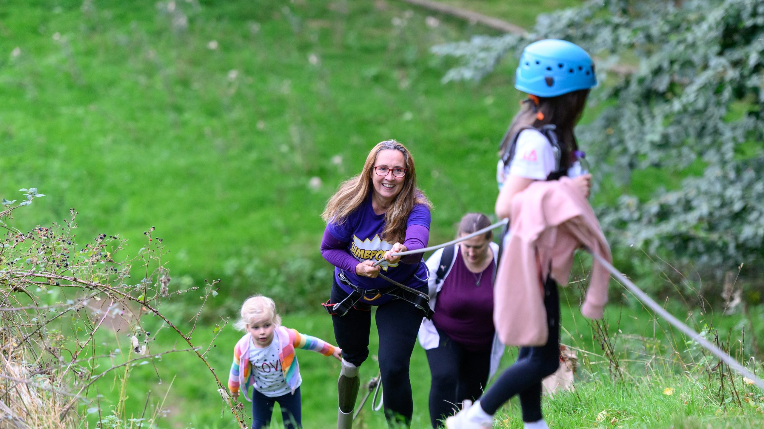 A group of women and girls climbing