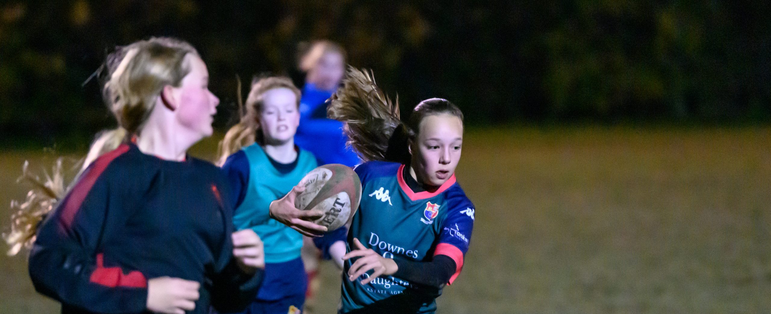 Girls playing rugby