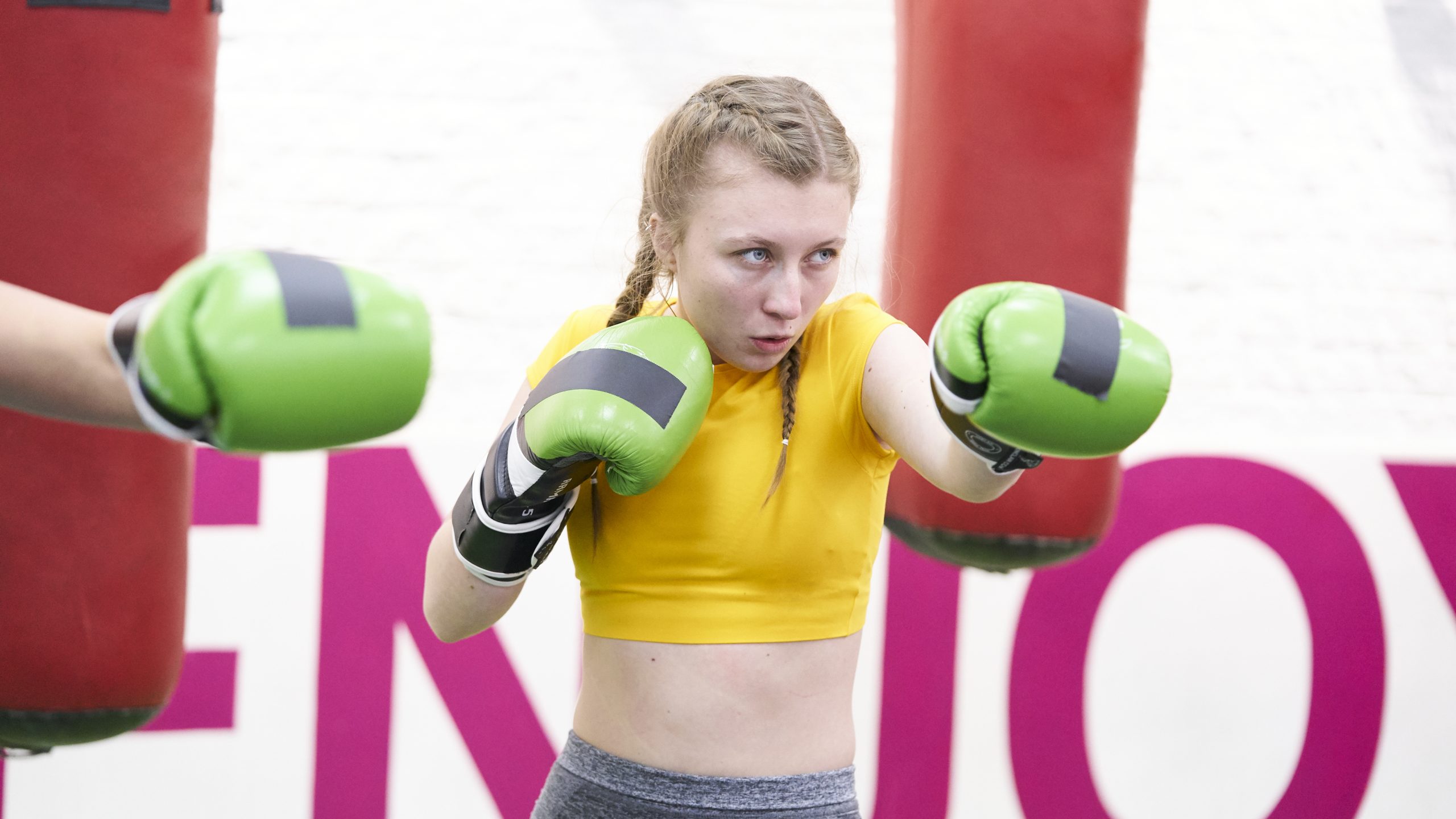 A white teenage girl boxing