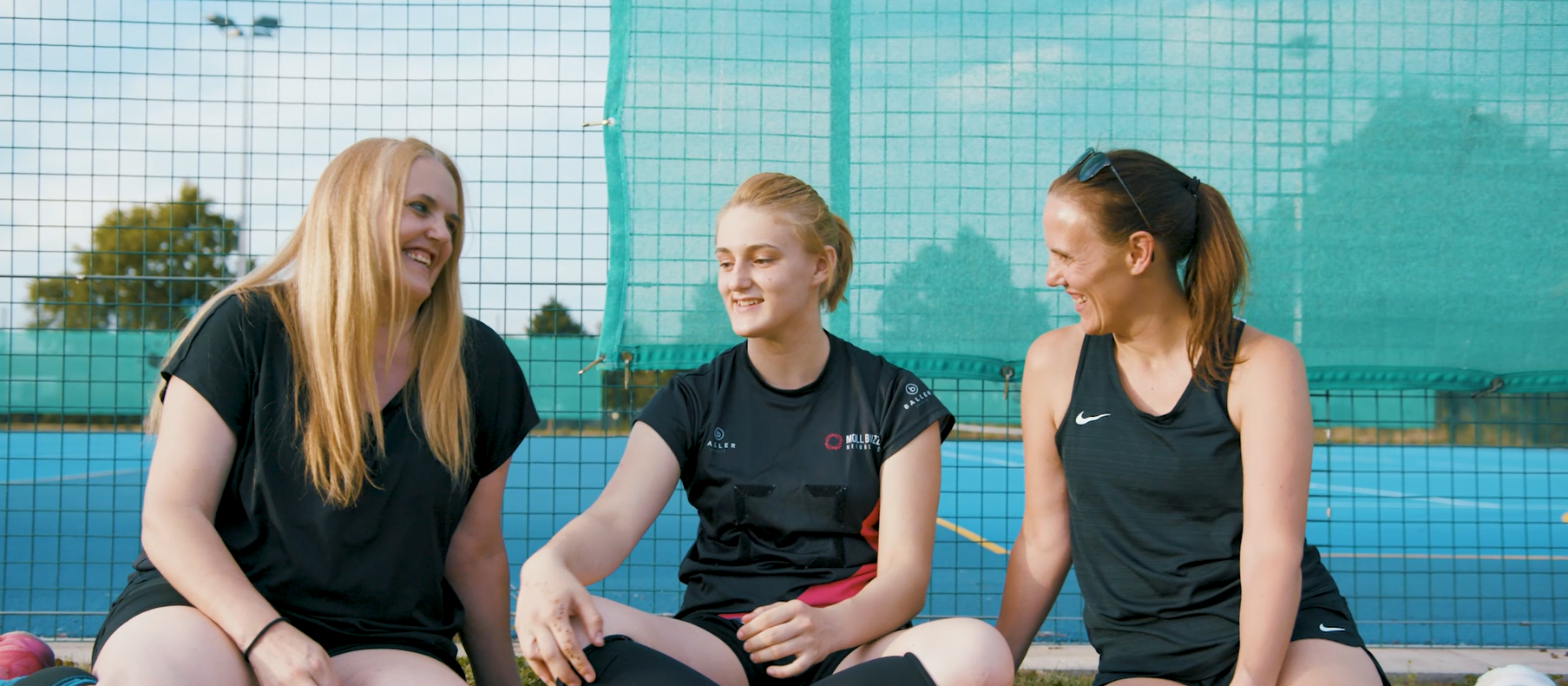 Mum Abi, daughter Matilda and auntie Ro playing netball together