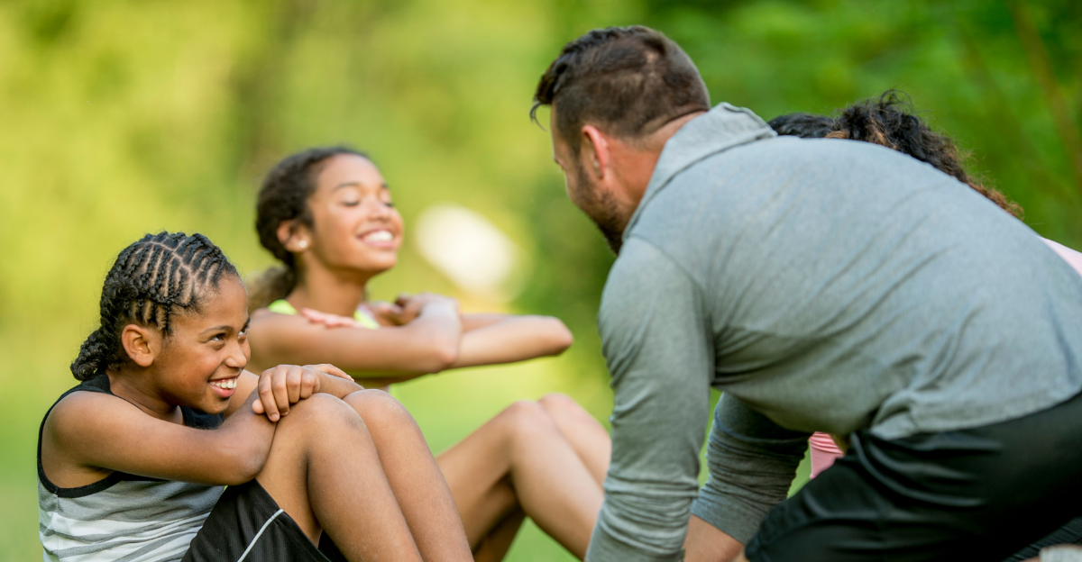 Dad and daughters exercising in the garden