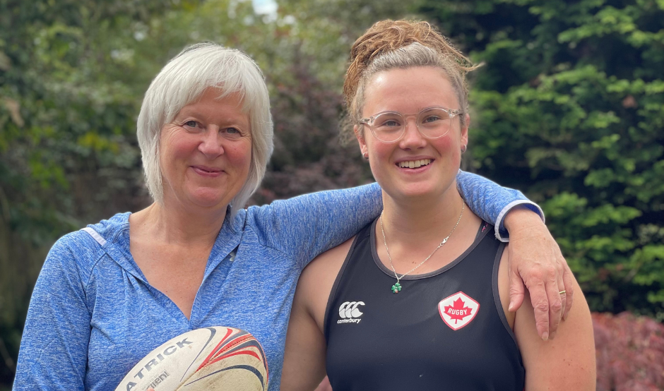 Mum and daughter playing rugby together